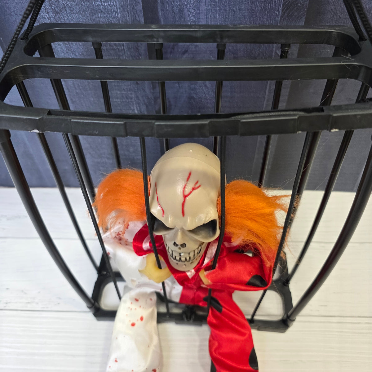 Animated Hanging Skeleton Cage – Bloody Clown