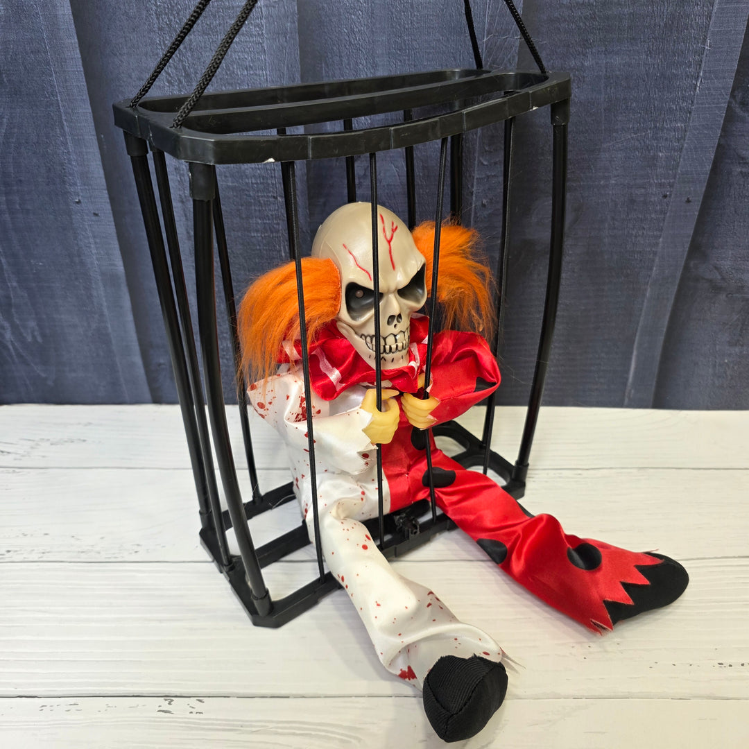 Animated Hanging Skeleton Cage – Bloody Clown